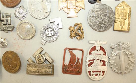 A large collection of various German Third Reich badges,
